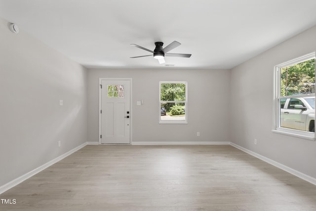768 Lunar Dr, Raleigh, NC 27610 - foyer with light wood-style floors and ceiling fan