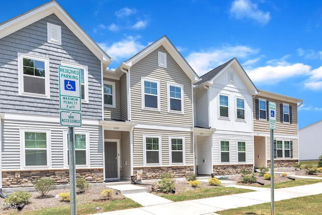 4949 Microcline Trl, Raleigh, NC 27610 - view of property featuring stone siding and board and batten siding