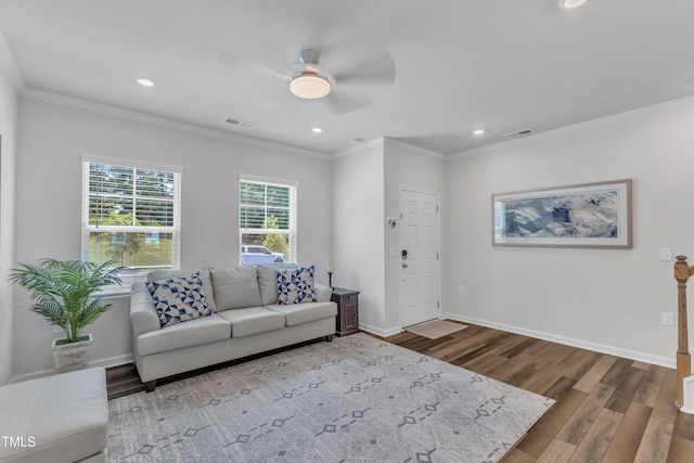 4949 Microcline Trl, Raleigh, NC 27610 - living area with ceiling fan, wood finished floors, recessed lighting, and crown molding