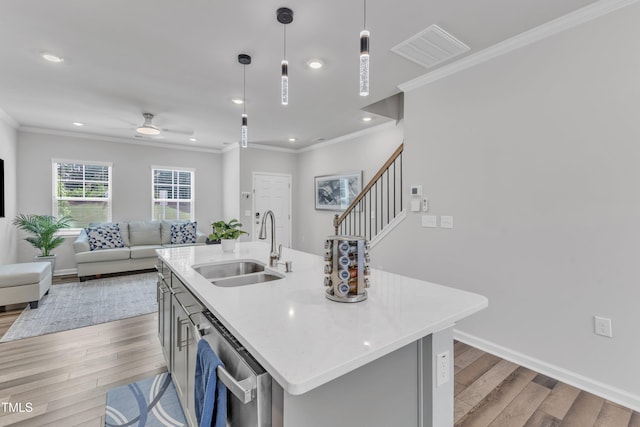 4949 Microcline Trl, Raleigh, NC 27610 - kitchen with open floor plan, light wood-style flooring, crown molding, a ceiling fan, and stainless steel dishwasher