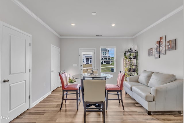 4949 Microcline Trl, Raleigh, NC 27610 - dining space with light wood-type flooring, ornamental molding, and recessed lighting