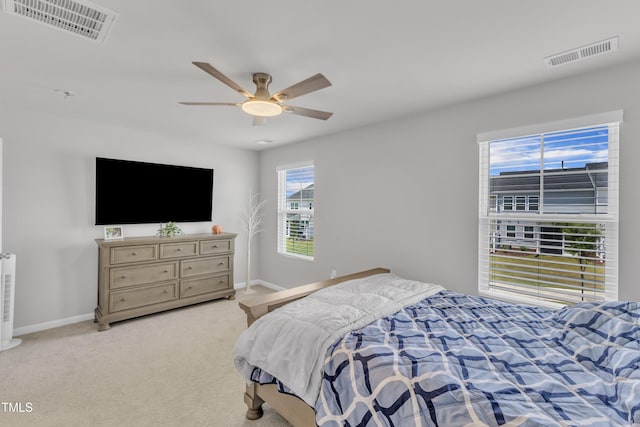 4949 Microcline Trl, Raleigh, NC 27610 - bedroom with light colored carpet and ceiling fan