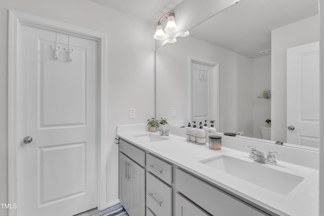 4949 Microcline Trl, Raleigh, NC 27610 - bathroom with double vanity and toilet