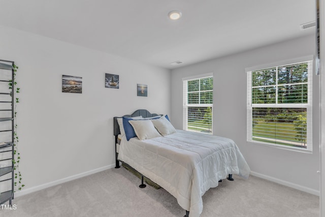 4949 Microcline Trl, Raleigh, NC 27610 - carpeted bedroom featuring baseboards