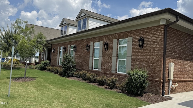 4949 Microcline Trl, Raleigh, NC 27610 - view of home's exterior featuring brick siding and a yard