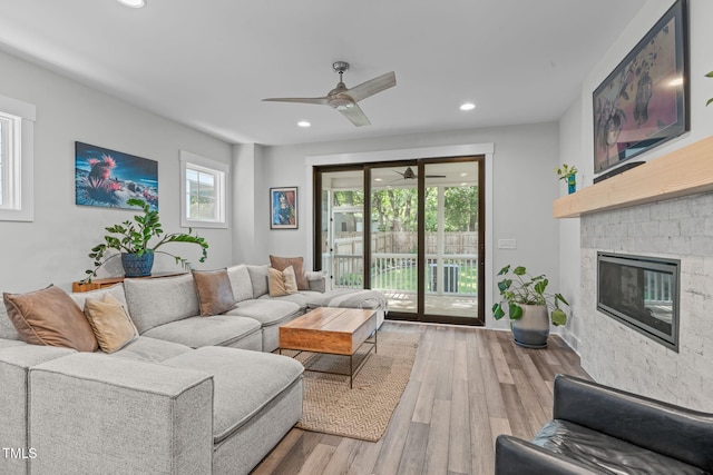 409 S Tunstall Ave, Apex, NC 27502 - living room with ceiling fan, wood finished floors, a fireplace, and recessed lighting