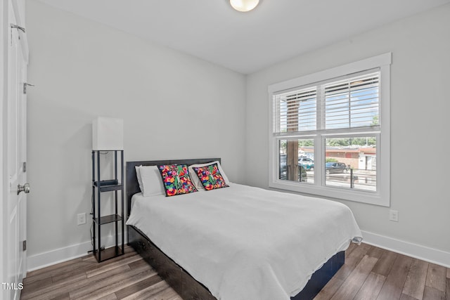 409 S Tunstall Ave, Apex, NC 27502 - bedroom featuring wood finished floors and baseboards