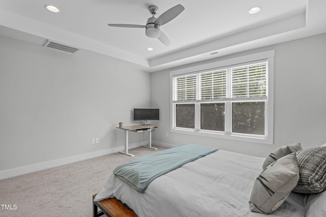 409 S Tunstall Ave, Apex, NC 27502 - carpeted bedroom featuring recessed lighting, a raised ceiling, and ceiling fan