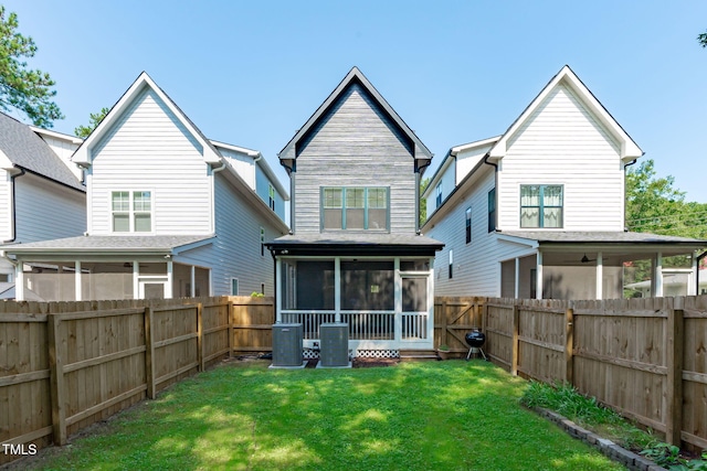 409 S Tunstall Ave, Apex, NC 27502 - rear view of house featuring a sunroom and a fenced backyard