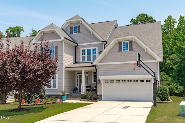 2716 Lake Waccamaw Trl, Apex, NC 27502 - craftsman house featuring concrete driveway, a front yard, a garage, covered porch, and a shingled roof