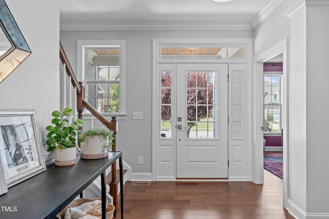 2716 Lake Waccamaw Trl, Apex, NC 27502 - foyer featuring stairs, plenty of natural light, hardwood / wood-style floors, and ornamental molding