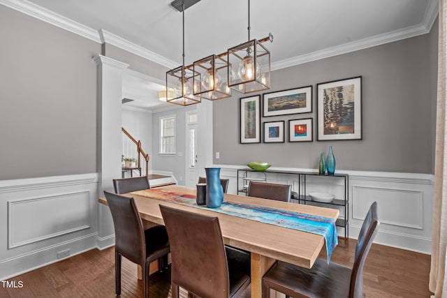 2716 Lake Waccamaw Trl, Apex, NC 27502 - dining room featuring crown molding, a chandelier, stairway, dark wood-style floors, and a wainscoted wall