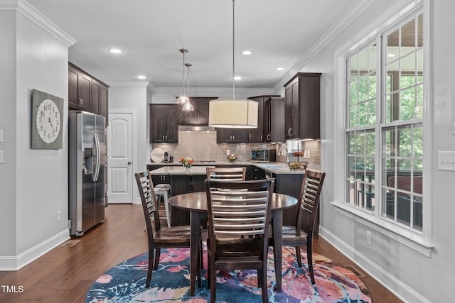 2716 Lake Waccamaw Trl, Apex, NC 27502 - dining room featuring crown molding, dark wood-type flooring, and recessed lighting