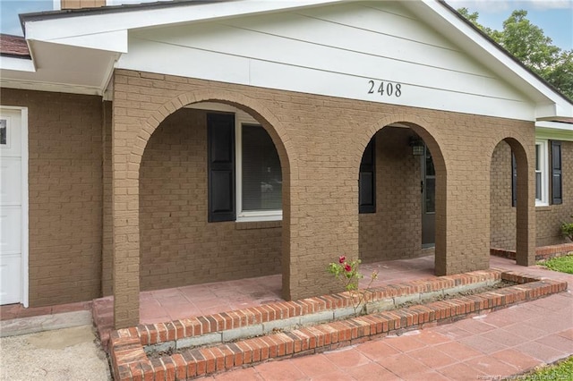 2408 Crabtree Ct, Fayetteville, NC 28304 - view of side of property with a porch and brick siding