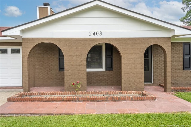 2408 Crabtree Ct, Fayetteville, NC 28304 - view of front of house with a porch, brick siding, and a garage
