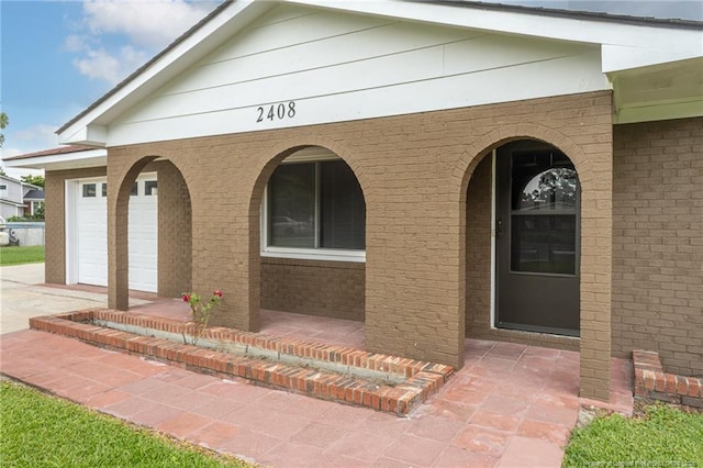 2408 Crabtree Ct, Fayetteville, NC 28304 - entrance to property with a porch, driveway, and brick siding