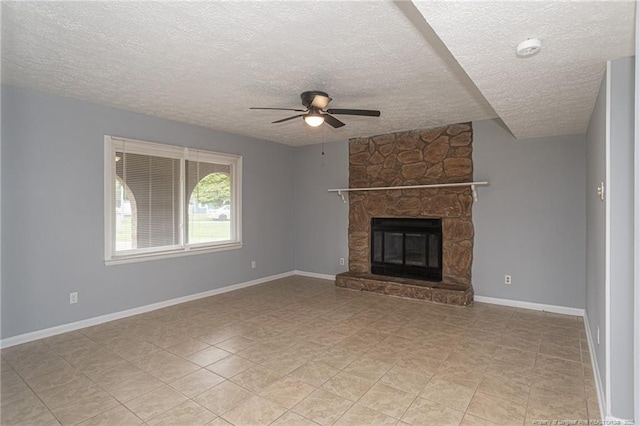 2408 Crabtree Ct, Fayetteville, NC 28304 - unfurnished living room featuring ceiling fan, a textured ceiling, a stone fireplace, and light tile patterned floors