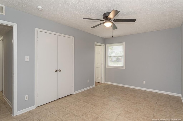 2408 Crabtree Ct, Fayetteville, NC 28304 - unfurnished bedroom featuring a textured ceiling, a closet, and ceiling fan