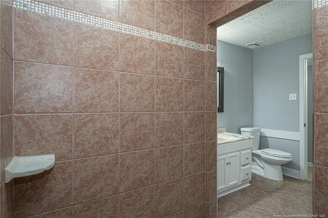 2408 Crabtree Ct, Fayetteville, NC 28304 - bathroom featuring vanity, a textured ceiling, and tile patterned floors