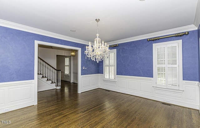 3112 Lake Pointe Trl, Rocky Mount, NC 27804 - unfurnished room with a chandelier, healthy amount of natural light, ornamental molding, wainscoting, and stairs