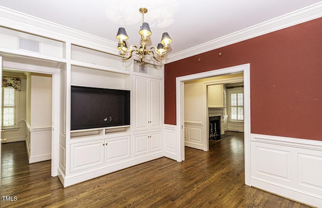 3112 Lake Pointe Trl, Rocky Mount, NC 27804 - unfurnished dining area featuring a chandelier, plenty of natural light, dark wood-type flooring, ornamental molding, and a wainscoted wall