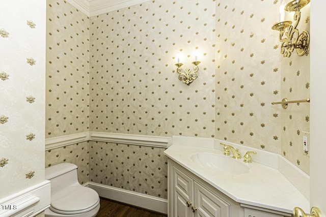 3112 Lake Pointe Trl, Rocky Mount, NC 27804 - half bathroom featuring wallpapered walls, vanity, wood finished floors, and crown molding
