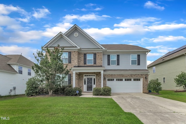 316 Vintage Holly Dr, Durham, NC 27703 - view of front of property with brick siding, concrete driveway, an attached garage, and a front yard