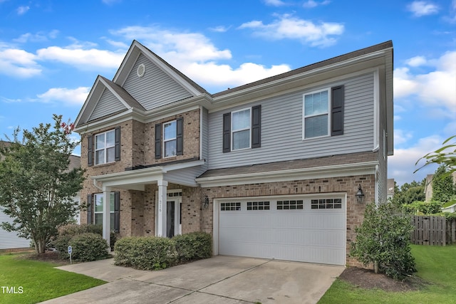 316 Vintage Holly Dr, Durham, NC 27703 - view of front of house featuring an attached garage, brick siding, and concrete driveway