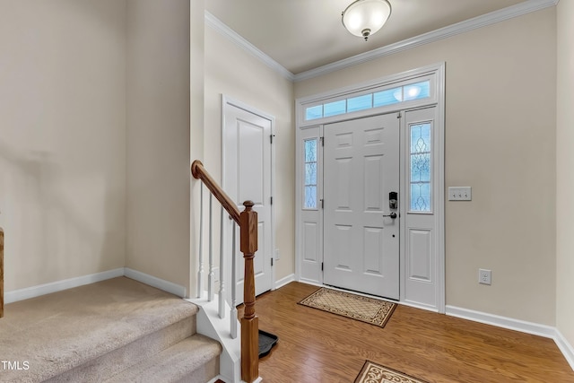 316 Vintage Holly Dr, Durham, NC 27703 - entryway with crown molding, stairs, and wood finished floors