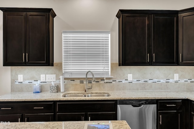 316 Vintage Holly Dr, Durham, NC 27703 - kitchen featuring stainless steel dishwasher, light stone counters, decorative backsplash, and dark brown cabinets