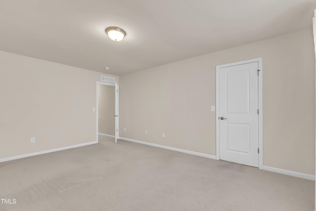 316 Vintage Holly Dr, Durham, NC 27703 - unfurnished room with light carpet and baseboards