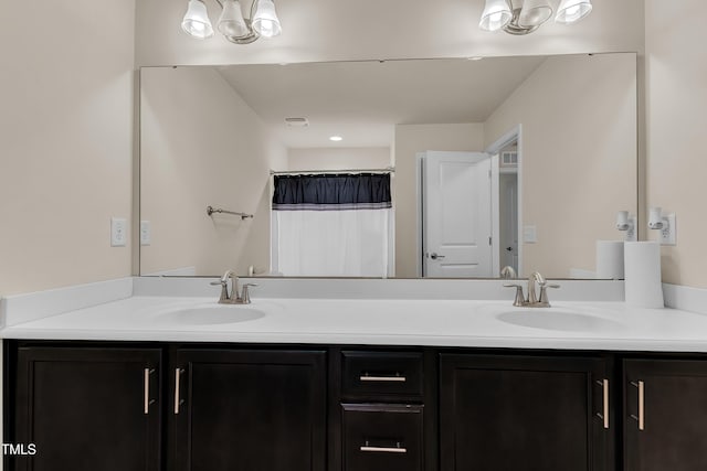 316 Vintage Holly Dr, Durham, NC 27703 - full bath with double vanity, curtained shower, and a chandelier