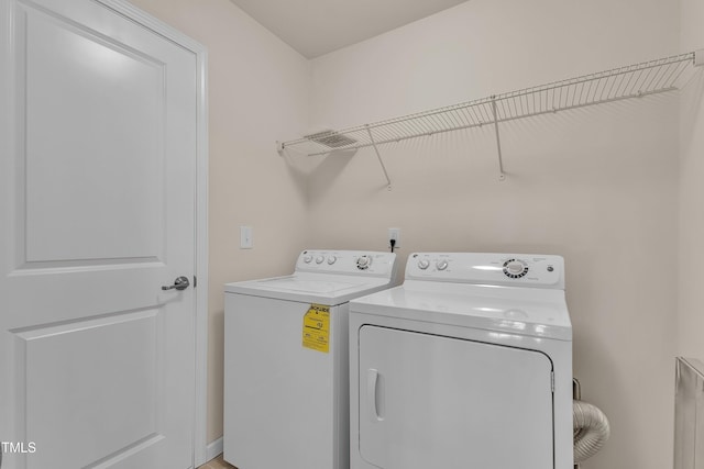 316 Vintage Holly Dr, Durham, NC 27703 - laundry room with washing machine and clothes dryer