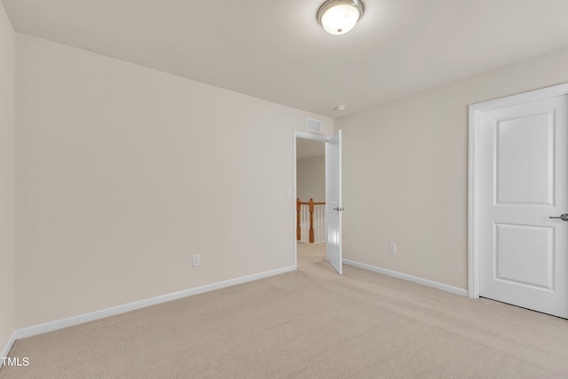 316 Vintage Holly Dr, Durham, NC 27703 - unfurnished bedroom with light carpet and baseboards