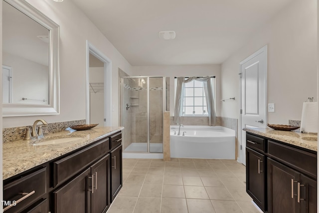 316 Vintage Holly Dr, Durham, NC 27703 - bathroom with vanity, a stall shower, a bath, and tile patterned floors