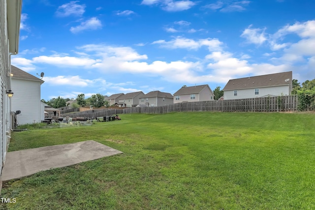 316 Vintage Holly Dr, Durham, NC 27703 - view of yard featuring a residential view and a patio