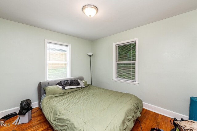 806 Eva St, Durham, NC 27701 - bedroom featuring wood finished floors and baseboards