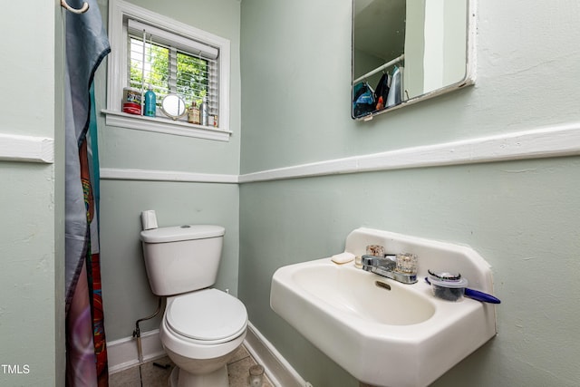 806 Eva St, Durham, NC 27701 - bathroom with tile patterned floors and a shower with curtain