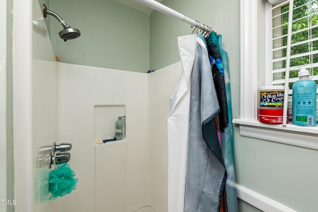 806 Eva St, Durham, NC 27701 - bathroom featuring a shower with shower curtain
