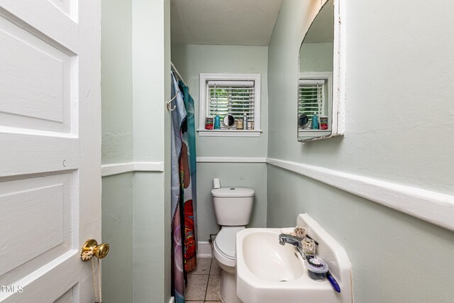806 Eva St, Durham, NC 27701 - full bathroom featuring tile patterned flooring and a shower with shower curtain
