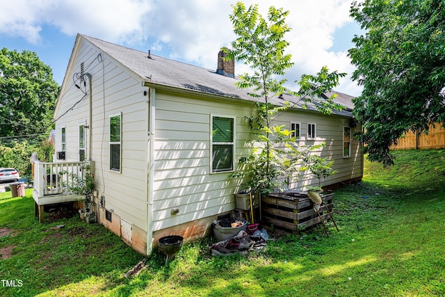 806 Eva St, Durham, NC 27701 - back of property featuring a chimney, a lawn, and crawl space