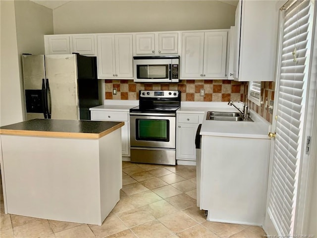 101 Horace Ct, Raeford, NC 28376 - kitchen with stainless steel appliances, white cabinets, backsplash, a center island, and light tile patterned floors