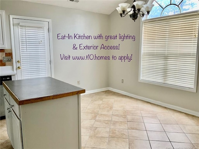 101 Horace Ct, Raeford, NC 28376 - unfurnished dining area featuring a chandelier and light tile patterned floors