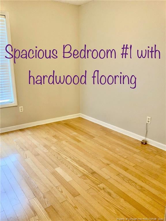 101 Horace Ct, Raeford, NC 28376 - empty room with light wood-style floors and plenty of natural light