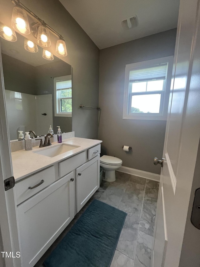 820 Christian Light Rd, Fuquay Varina, NC 27526 - bathroom featuring marble finish floors, vanity, and a shower
