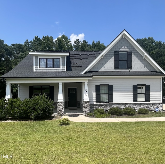 820 Christian Light Rd, Fuquay Varina, NC 27526 - craftsman-style house featuring a front yard, stone siding, a porch, and a shingled roof