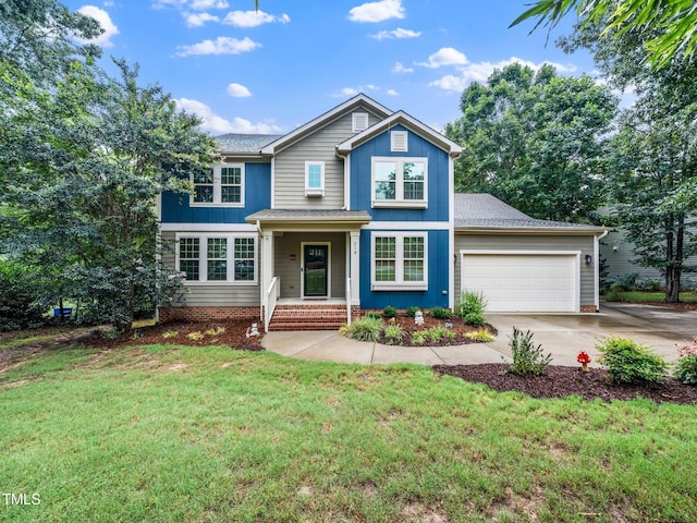 218 Inwood Forest Dr, Raleigh, NC 27603 - traditional-style house featuring board and batten siding, a garage, driveway, and a front yard