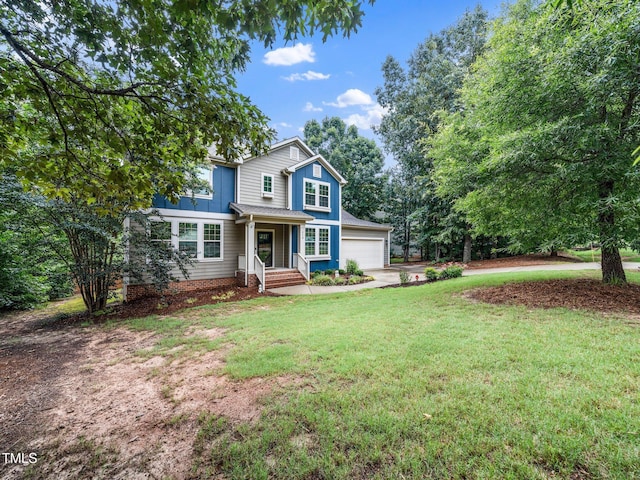 218 Inwood Forest Dr, Raleigh, NC 27603 - traditional-style home featuring driveway, a front yard, and board and batten siding