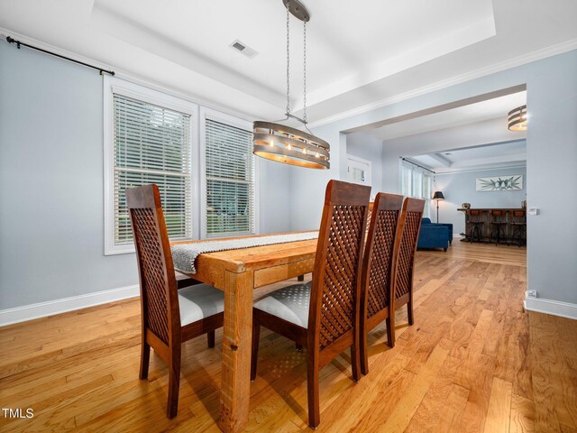 218 Inwood Forest Dr, Raleigh, NC 27603 - dining room with a raised ceiling and light wood-type flooring