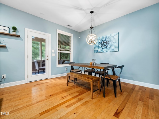 218 Inwood Forest Dr, Raleigh, NC 27603 - dining room with light wood-style floors and a chandelier